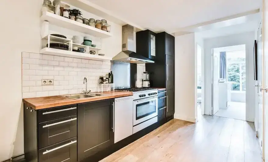 Beautiful interior of an elite house featuring a straight modular kitchen design with high-end finishes, elegant cabinetry, and a sophisticated layout.