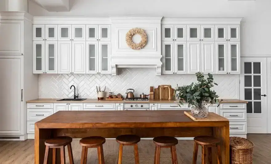 Kitchen interior design featuring a straight modular layout with a wooden table, modern cabinetry, and contemporary decor.