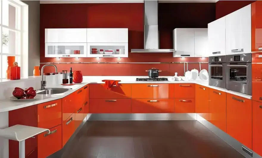  Modern U shape modular kitchen design featuring orange and white cabinets, with a sleek and vibrant layout that enhances functionality and style.